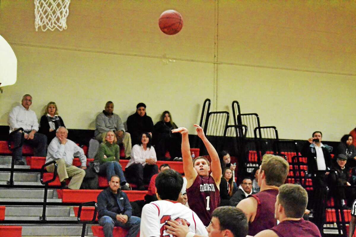 Torrington’s Zak Mancini takes a three-pointer in the Red Raiders 79-54 win over Derby. Mancini scored 20 points in the win.
