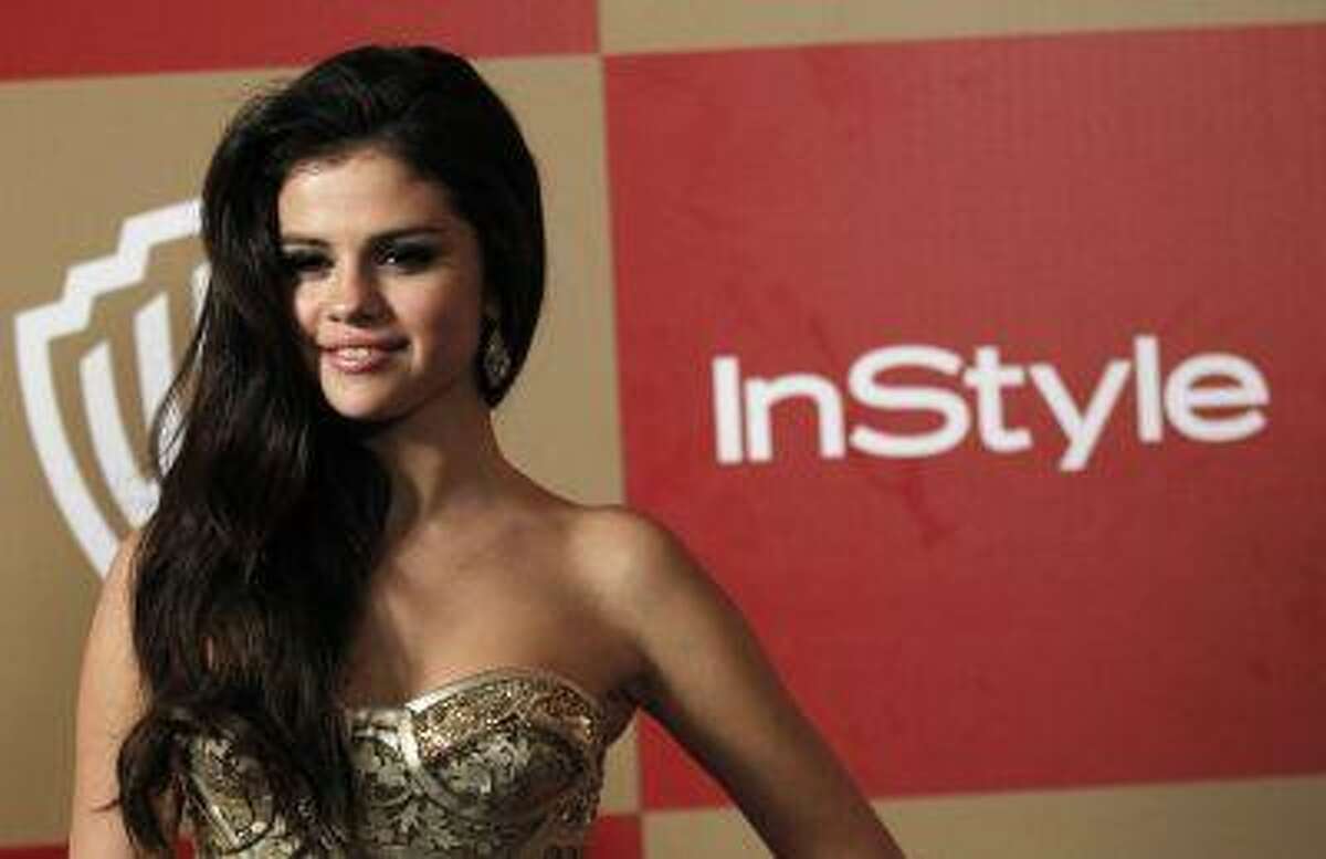 Actress Selena Gomez poses at the InStyle/Warner Bros. after party following the 70th annual Golden Globe Awards in Beverly Hills, Calif. Reuters/Mario Anzuoni