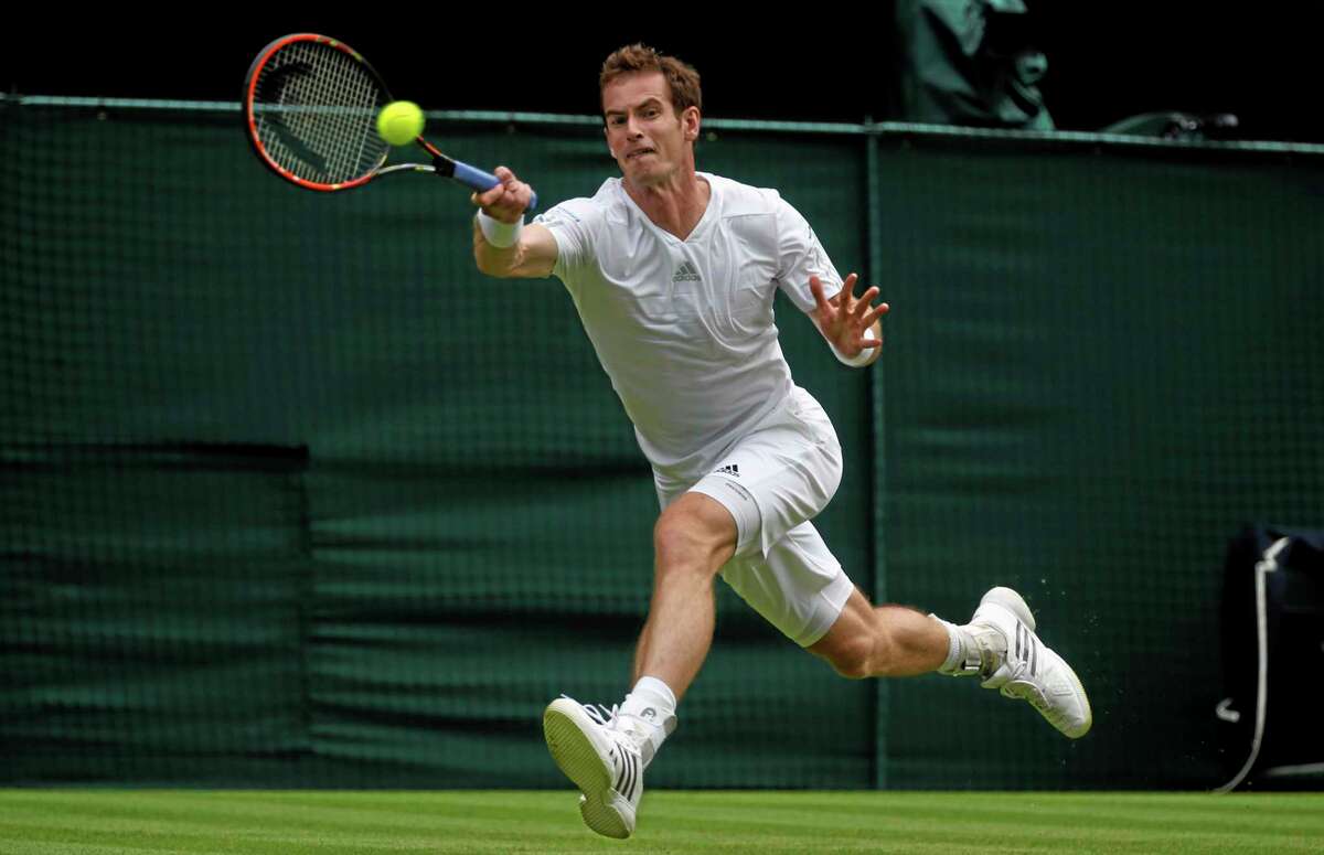 Andy Murray of Britain plays a return to David Goffin of Belgium during their first round match at the All England Lawn Tennis Championships in Wimbledon, London, Monday, June 23, 2014. (AP Photo/Pavel Golovkin)