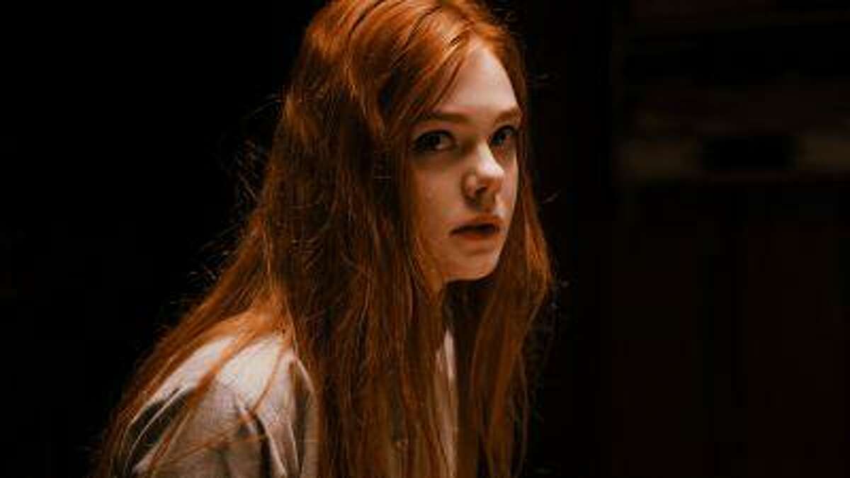 This publicity photo released by A24 Films shows Elle Fanning as Ginger in a scene from the film, "Ginger and Rosa," directed by Sally Potter. (AP Photo/A24 Film, Nicola Dove)