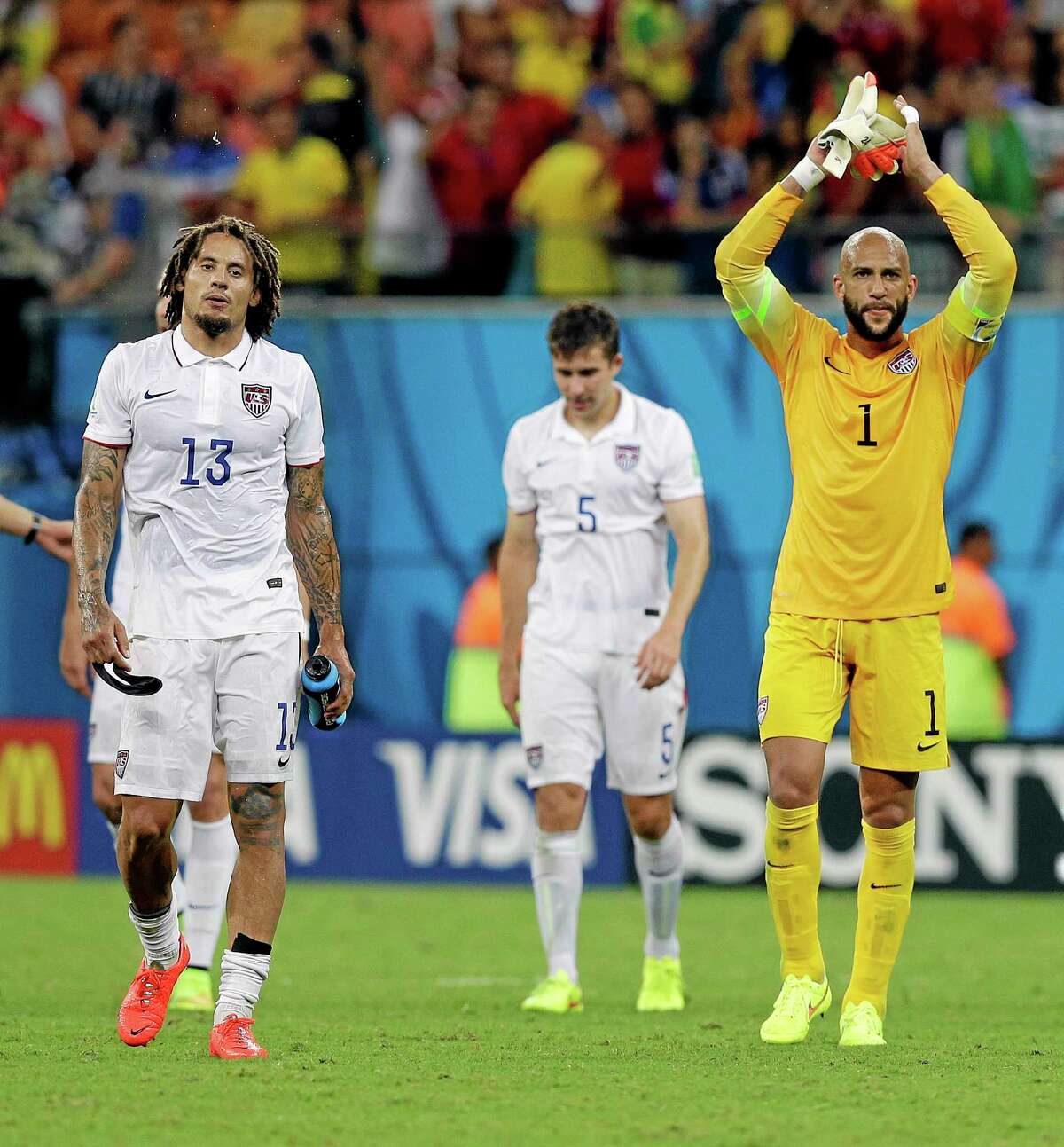 United States’ goalkeeper Tim Howard and United States’ Jermaine Jones walk off the pitch following their 2-2 draw with Portugal on Sunday.