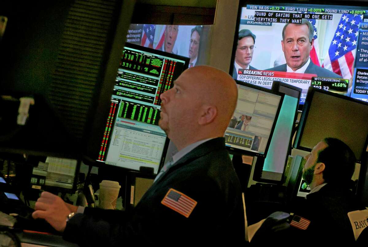 House Speaker John Boehner is visible on a television screen from Washington, on the floor of the New York Stock Exchange, Thursday, Oct. 10, 2013. Boehner told Republican lawmakers Thursday he will give President Barack Obama a proposal extending the government's ability to borrow money through Nov. 22, but only if he agrees to negotiate over ending the partial government shutdown and a longer-term increase in the debt ceiling. (AP Photo/Richard Drew)