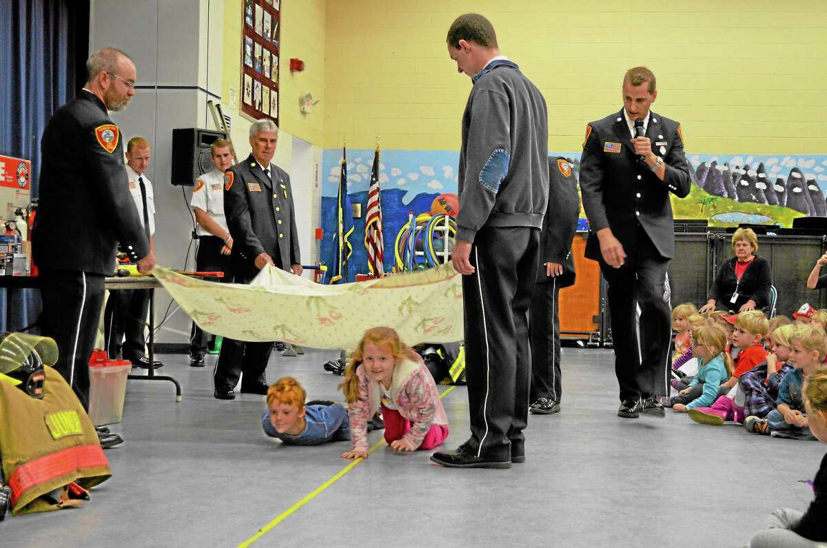 Students demonstrated fire safety practices at an assembly at the Harwinton Consolidated School, Thursday.
