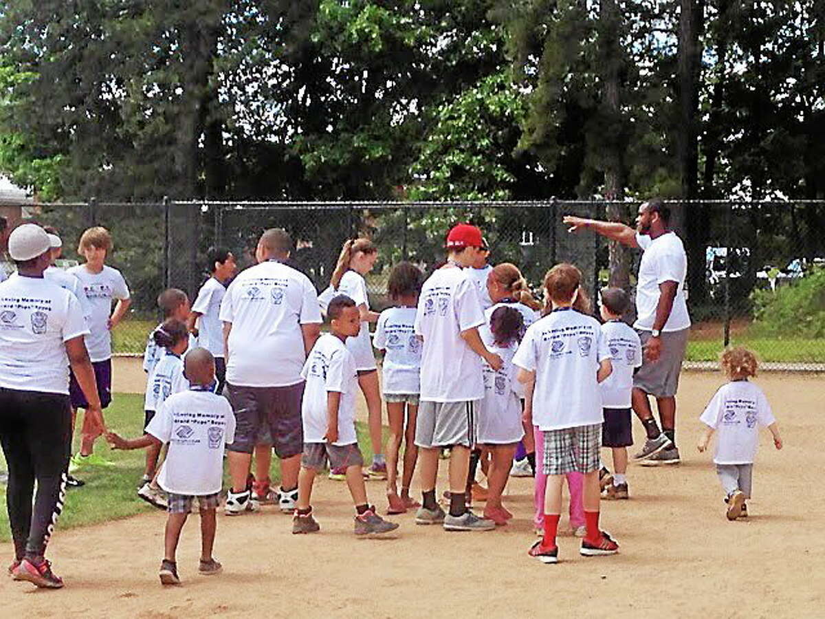 Former UConn star and current San Diego Chargers defensive end Kendall Reyes returned to his hometown of Nashua, N.H., to host his second R.E.Y.E.S Family Field Day.