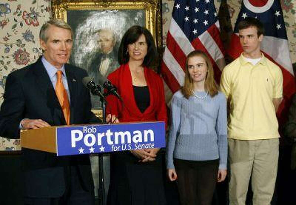 In this Wednesday, Jan. 14, 2009 photo, U.S. Sen. Rob Portman, from left, with his wife, Jane, daughter Sally, and son Will, stands after announcing that he will run for the U.S. Senate, in Lebanon, Ohio. Portman is now supporting gay marriage and says his reversal on the issue began when he learned his son Will is gay. (AP Photo/David Kohl)