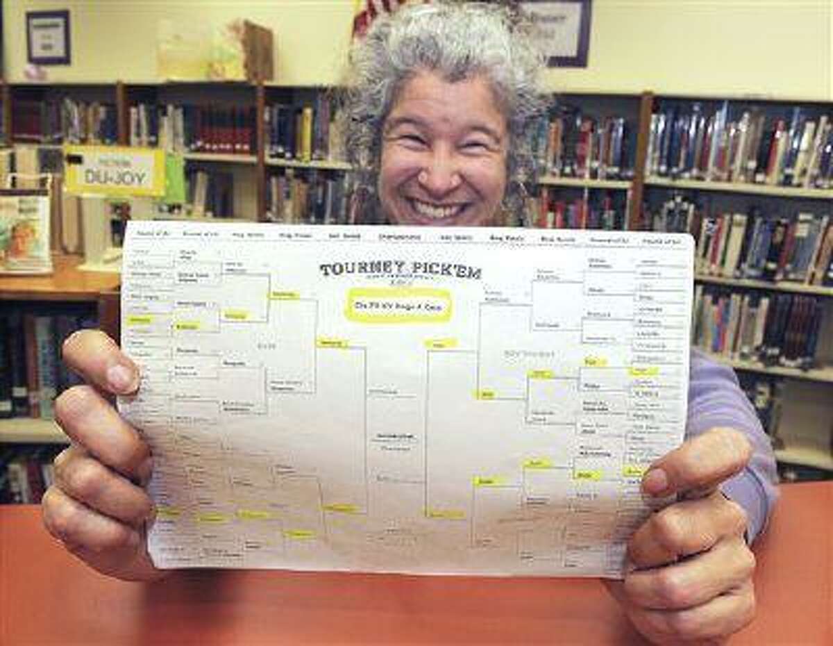 Jefferson (Ore.) High School librarian Diana Inch displays her winning NCAA tournament bracket from Yahoo.com's online contest in 2011. The odds of completing the perfect bracket by picking the higher-seeded team are 35 billion to 1. We look at alternative formats.