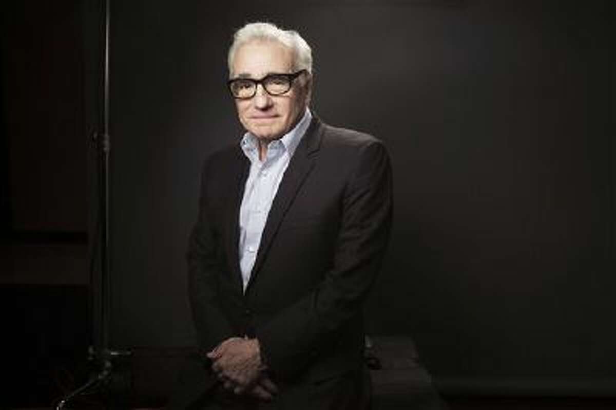 This Dec. 15, 2013 photo shows American film director Martin Scorsese in New York. Scorsese?s portrait of Wall Street excess has been judged by some critics and moviegoers as a glorification of unchecked greed. But the movie?s bad reputation as an orgy of drugs, sex and money has also drawn eager crowds.