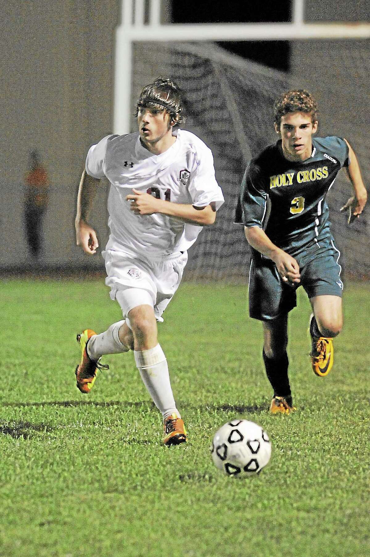 Torrington’s Shane Walker looks to make a pass during the Red Raiders 3-1 win over Holy Cross. Walker scored the second and eventual game-winning goal.