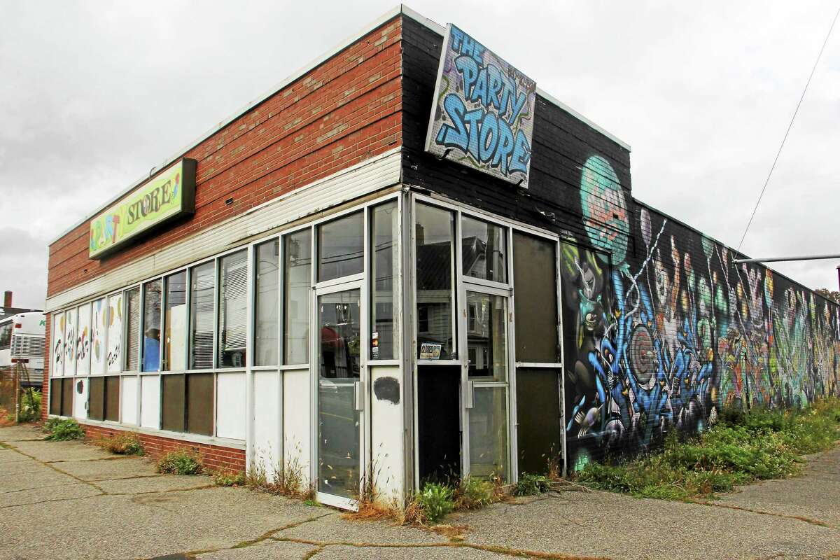 A building that once housed a party supply store sits vacant at 136 Water St. Wednesday in Torrington. The lot has been purchased by a manufacturer across the street.