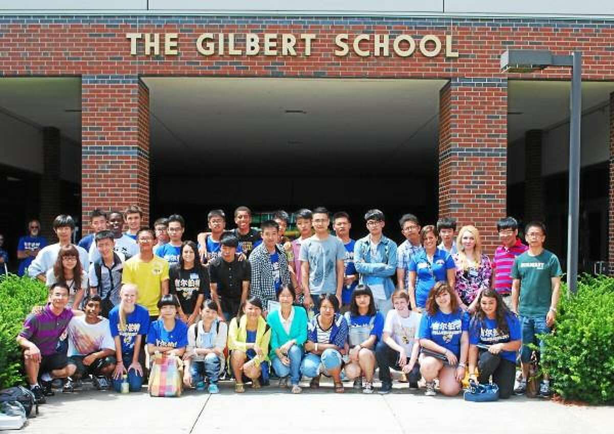 Contributed photo International students from China gather outside of the Gilbert School after the closing ceremony.