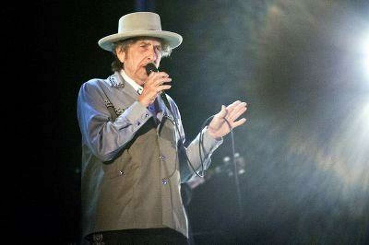 Bob Dylan performs at Bayfront Festival Park in Duluth, Minn. Tuesday July 9, 2013 during a stop on the Americanarama Festival of Music. (AP Photo/Duluth News, Clint Austin)