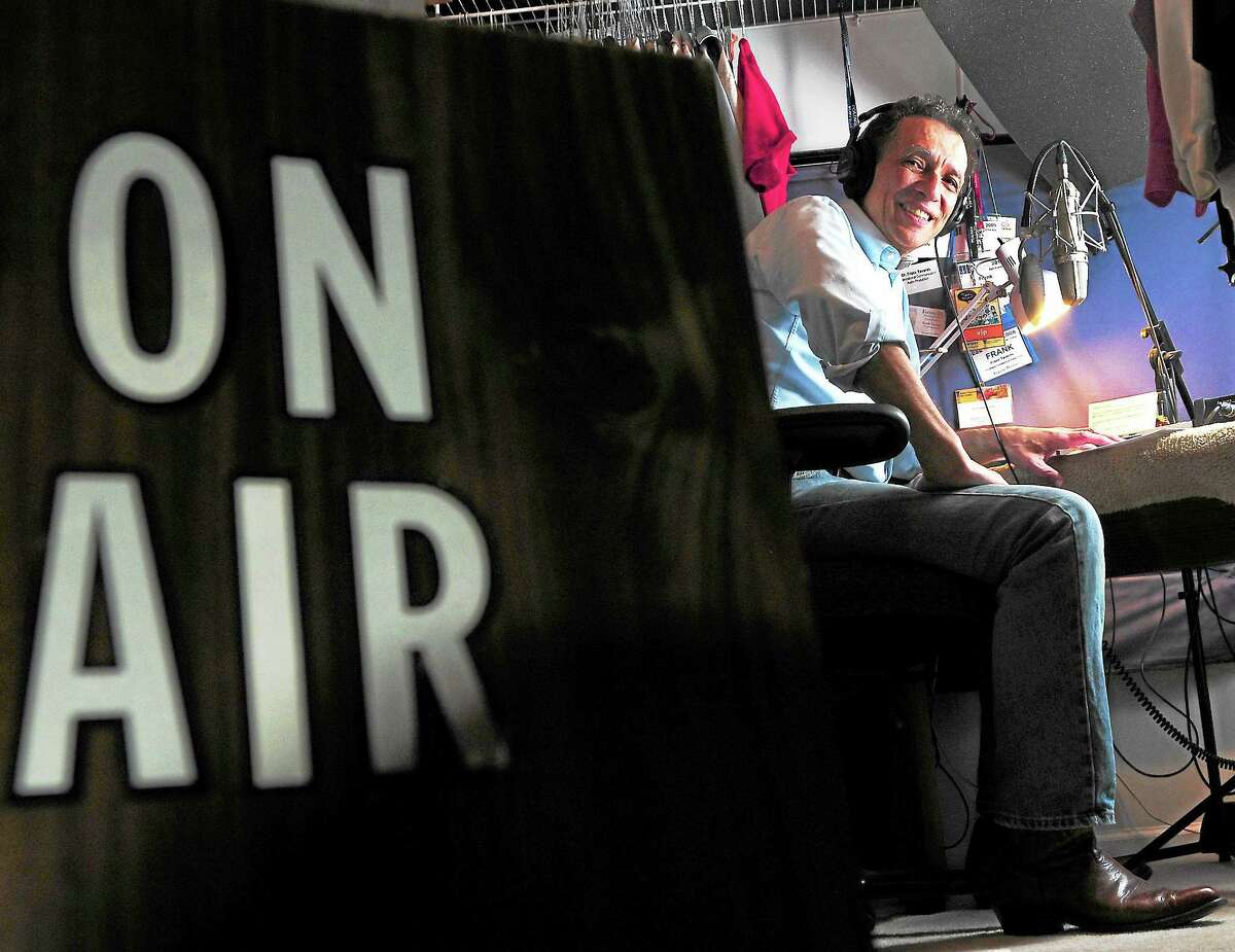 Frank Tavares, a recently retired National Public Radio announcer, in his longtime makeshift radio studio in the closet of his Hamden home.