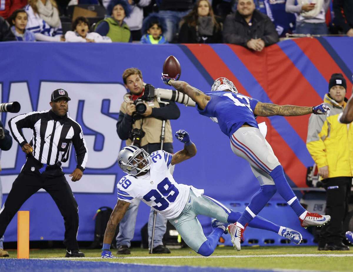 Kathy Willens — The Associated Press Giants wide receiver Odell Beckham Jr. (13) makes a one-handed catch for a touchdown in the second quarter Sunday.