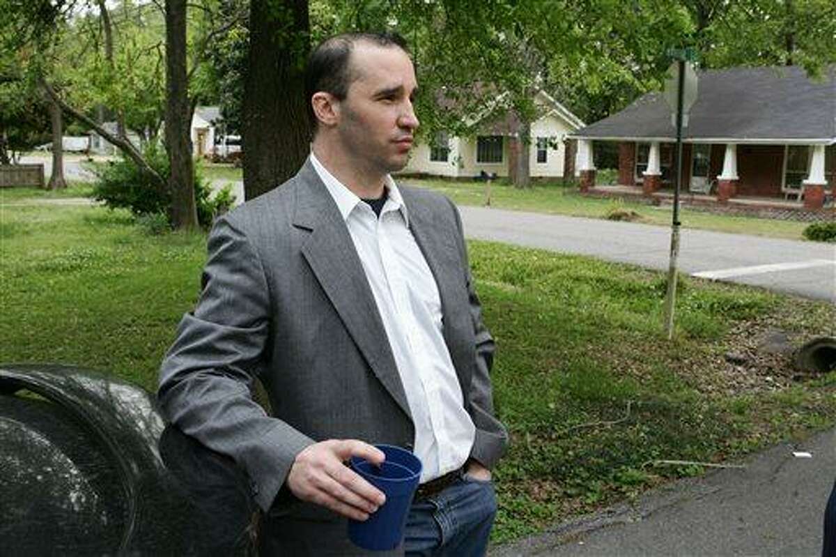 FILE - In this Tuesday April 23, 2013 file photo, Everett Dutschke stands in the street near his home in Tupelo, Miss., and waits for the FBI to arrive and search his home in connection with the sending of poisoned letters to President Barack Obama and others. FBI spokeswoman Deborah Madden says Dutschke, 41, was arrested Saturday, April 27, 2013, at his Tupelo home in connection with the letters, which allegedly contained ricin. They were sent last week to Obama, Sen. Roger Wicker of Mississippi and earlier to 80-year-old Mississippi Judge Sadie Holland. (AP Photo/Northeast Mississippi Daily Journal, Thomas Wells, File) MANDATORY CREDIT