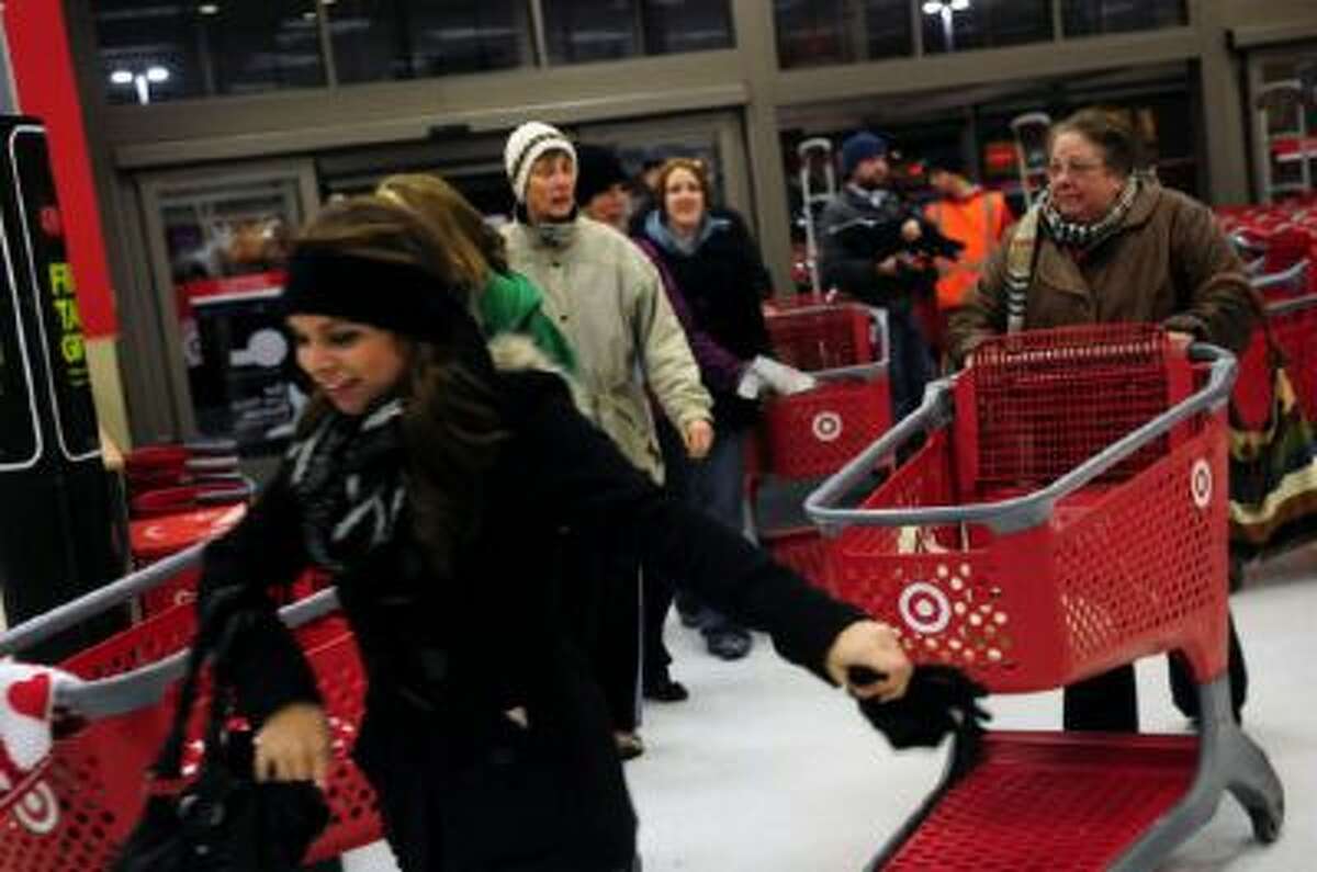 Shoppers rush into the Roseville Target store on Black Thursday, Thanksgiving night, to buy stuff for cheap, on November 22, 2012.