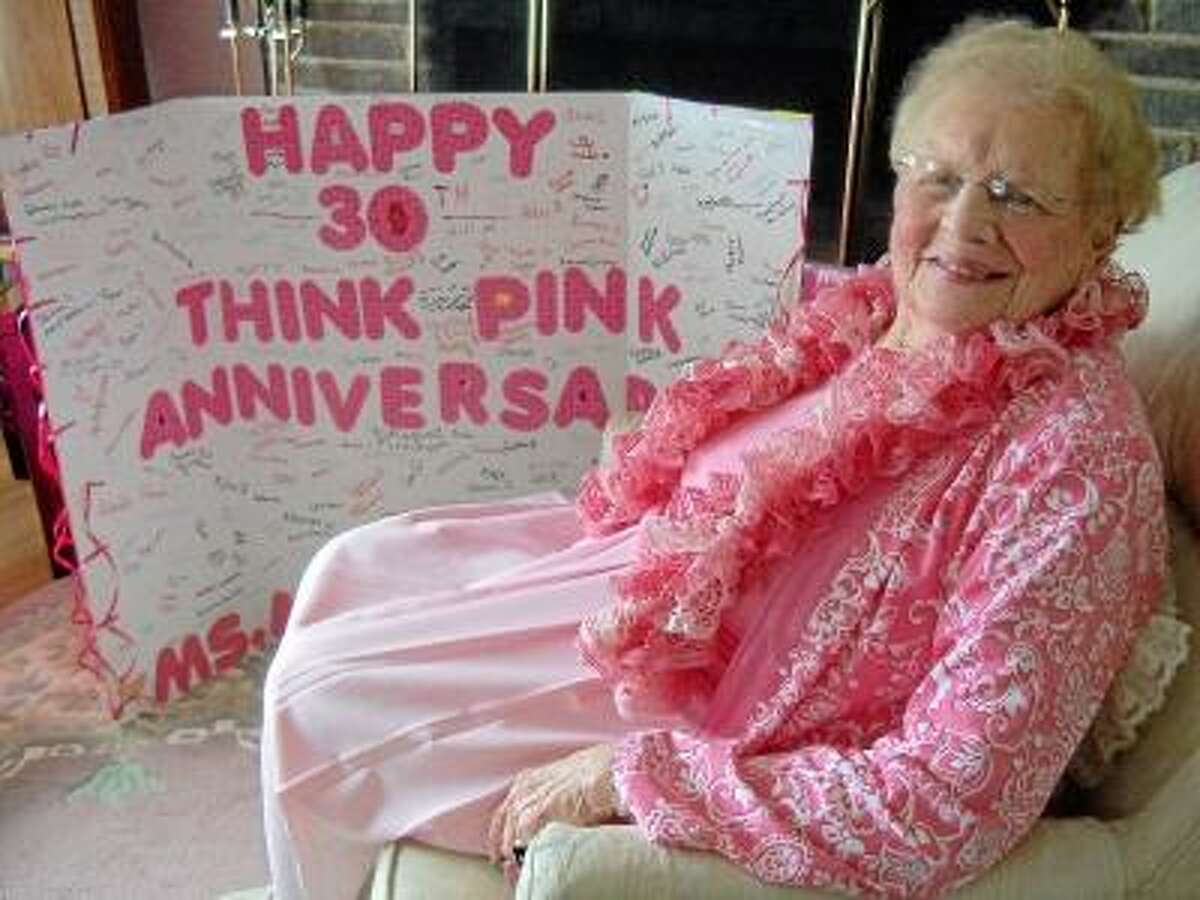 Photo by Scot Allyn Martha Macdonald, 92, with the card made for her by Thomaston students in honor of 30 years of Think Pink day.