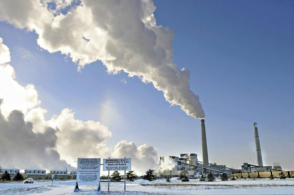 File-This Dec. 5, 2013, file photo shows the Sherco power plant in Becker, Minn. Minnesota, which already successfully lowered carbon emissions and capitalized on renewable energy sources, must cut carbon dioxide emissions by nearly 41 percent over the next 15 years as part of a sweeping plan President Barack Obama announced Monday, June 2, 2014, to reduce pollution from power plants. (AP Photo/St. Cloud Times, Jason Wachter, File)