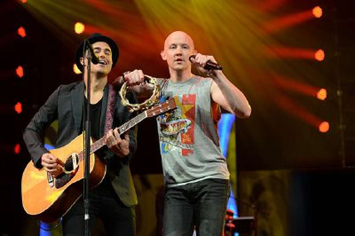 Joe King (L) and Isaac Slade (R) of The Fray performs during Amnesty Internationals "Bringing Human Rights Home" concert February 5, 2014 at the Barclays Center in the Brooklyn borough of New York. AFP PHOTO/Don EMMERT (Photo credit should read DON EMMERT/AFP/Getty Images)