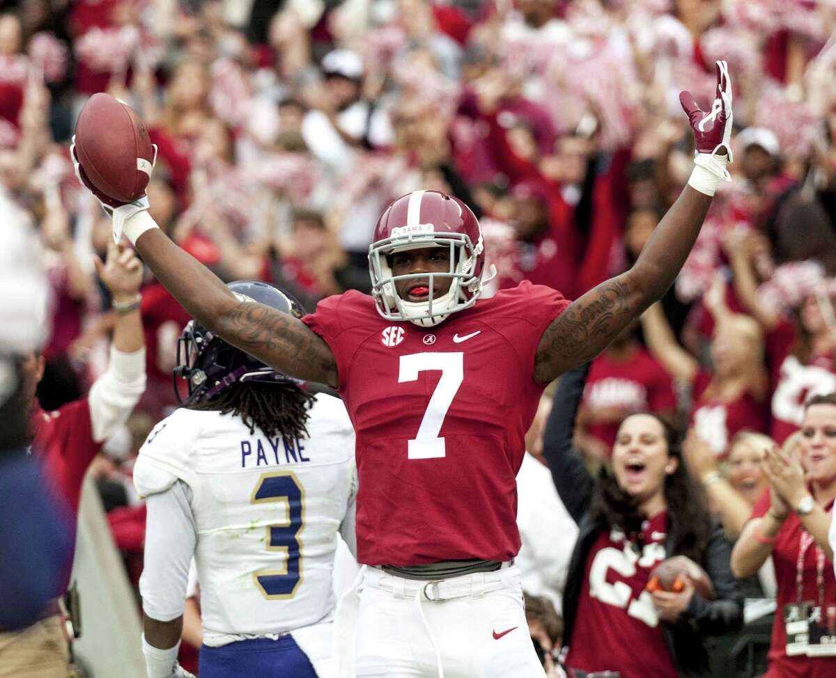 Alabama wide receiver Cam Sims (7) celebrates a touchdown during the first quarter of Saturday’s win over Western Carolina.