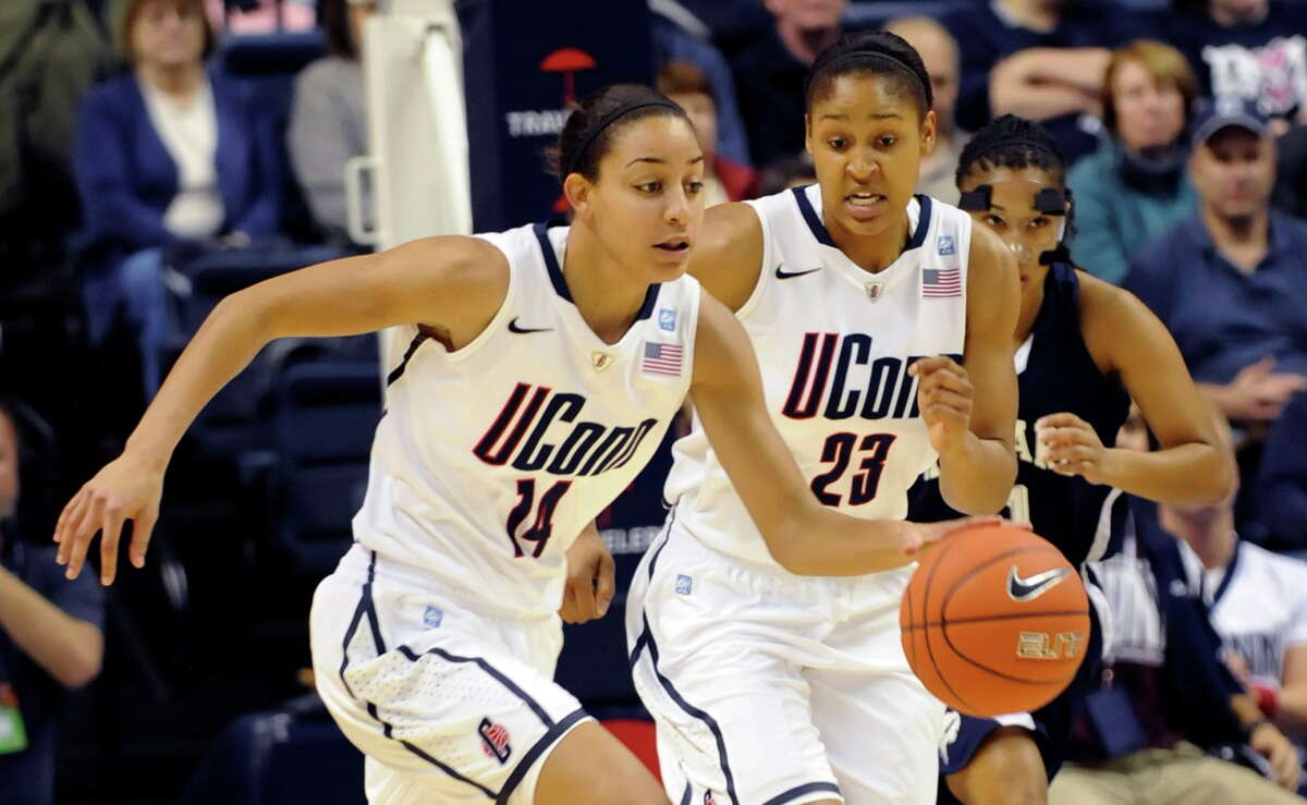 Bria Hartley, left, and Maya Moore were teammates for just one year, back in the 2010-11 season. They are now the only two players in the history of the UConn women’s basketball program to record 1,500 points, 500 rebounds, 500 assists and 200 steals.