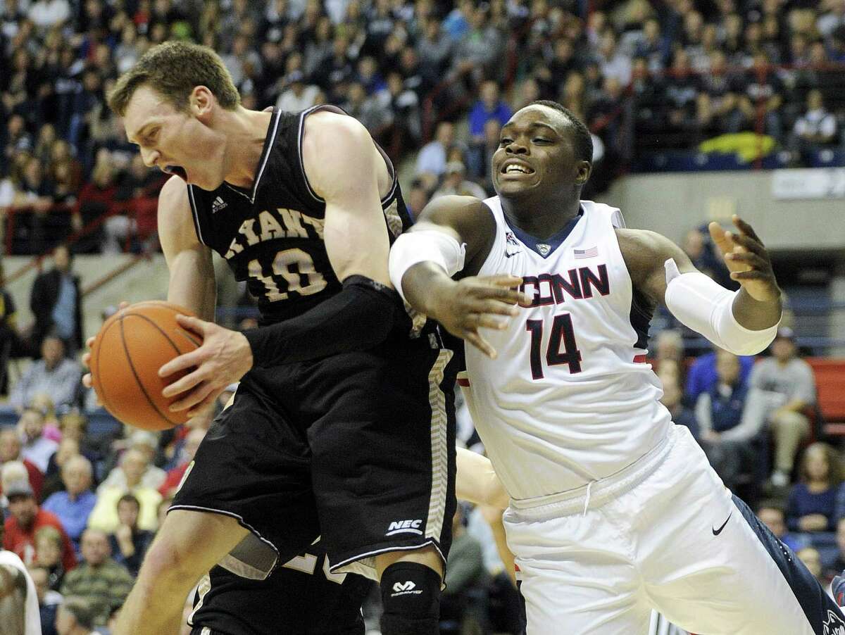 UConn’s Rakim Lubin, right, was suspended for Sunday night’s game due to a violation of team rules.