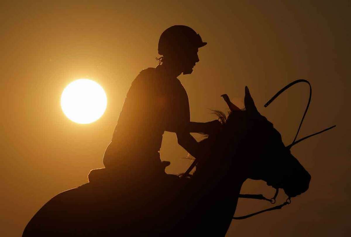 Saratoga Race Course pony boy Jesse Costa rides Vegas early Thursday morning, July 18, 2013, in Saratoga Springs, N.Y. The 150th horse racing meet at Saratoga opens on Friday. (AP Photo/Mike Groll)