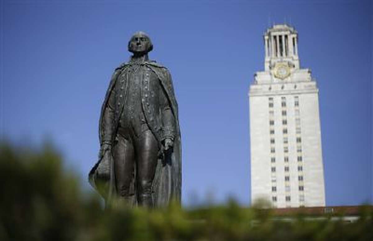 ADVANCE FOR SUNDAY FEB. 3 AND THEREAFTER - A statue of George Washington stands near the University of Texas Tower at the center of campus, Thursday, Nov. 29, 2012, in Austin, Texas. If colleges were automobiles, the University of Texas at Austin would be a Cadillac: a famous brand, a powerful engine of research and teaching, a pleasingly sleek appearance. Even the price is comparable to the luxury car's basic model: In-state tuition runs about $40,000 for a four-year degree. (AP Photo/Eric Gay)