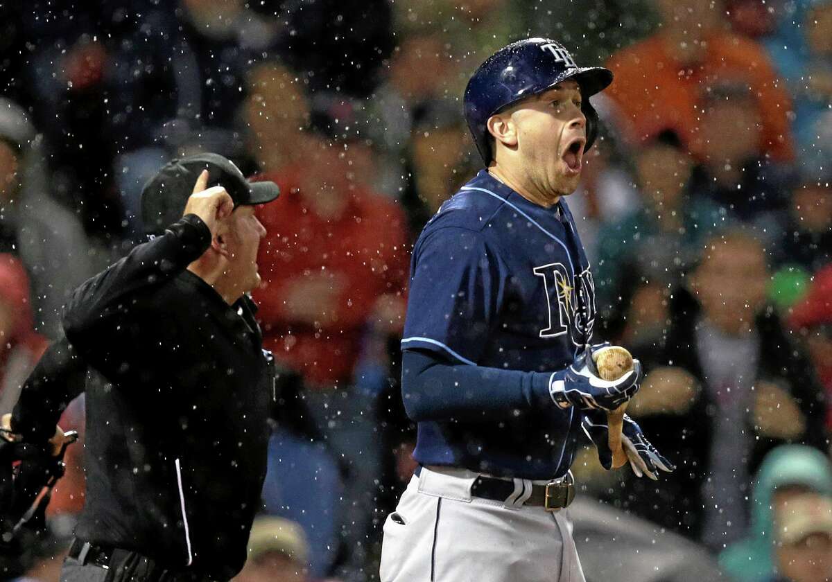 Tampa Bay Rays batter Evan Longoria reacts after narrowly getting hit by a pitch as home plate umpire Dan Bellino immediately tosses Boston Red Sox pitcher Brandon Workman from the game during the sixth inning Friday at Fenway Park in Boston.