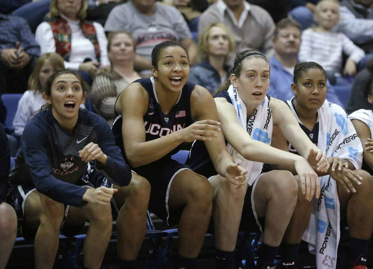 UConn players celebrate from the bench during the Huskies’ 102-43 win at UC Davis on Nov. 14.