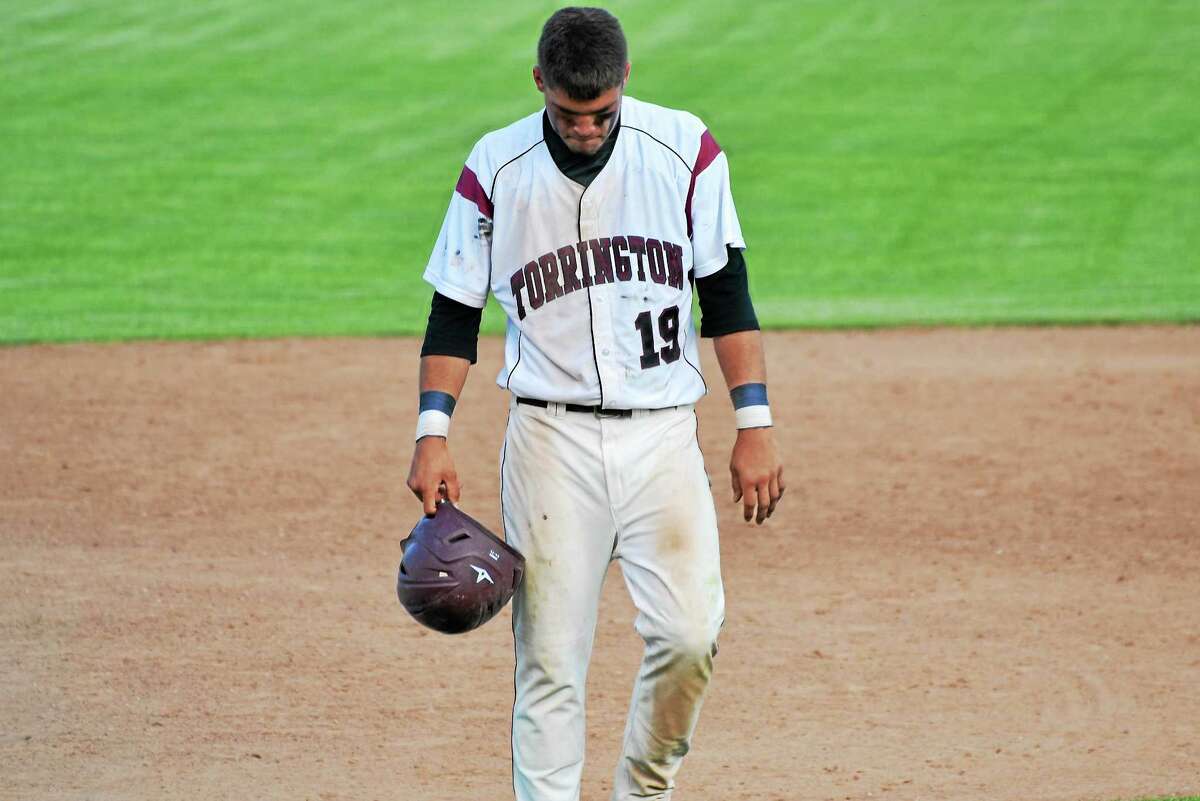 Torrington’s Dom Sabia walks off the field, after the final out in the Red Raiders’ 5-2 loss to Maloney in the second round of the Class L state tournament.