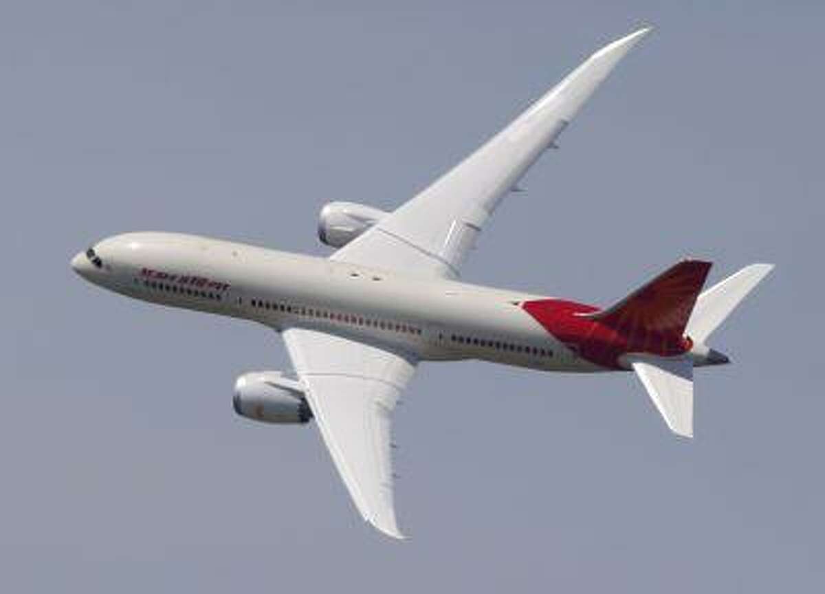 An Air India Boeing 787 Dreamliner performs its demonstration flight during the first day of the 50th Paris Air Show at Le Bourget airport, north of Paris, Monday, June 17, 2013. (Associated Press/Francois Mori)