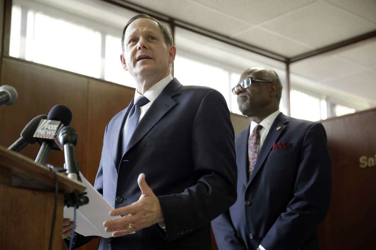 St. Louis Mayor Francis Slay, left, speaks as St. Louis County Executive Charlie A. Dooley listens during a news conference Friday, Nov. 21, 2014, in Clayton, Mo. Slay and Dooley spoke about preparations as the area waits for a decision from the grand jury whether to indict Ferguson police officer Darren Wilson in the shooting of Michael Brown. (AP Photo/Jeff Roberson)