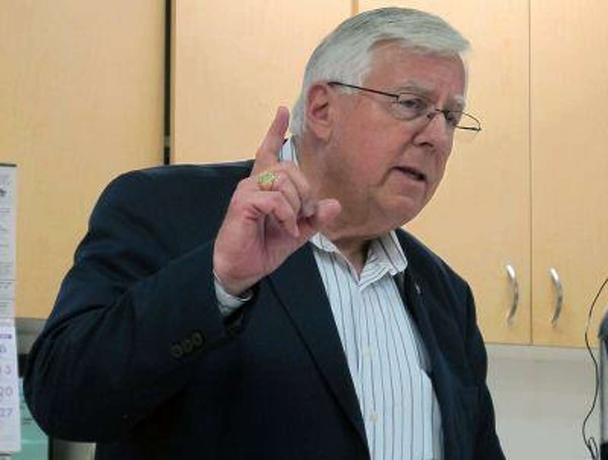 This July 2,2013 photo shows U.S. Sen. Mike Enzi, R-Wyo., speaks to constituents at a senior center in Pine Bluffs, Wyo. Enzi hasn't said yet whether he will seek re-election to the Senate while Liz Cheney, daughter of former Vice President Dick Cheney, has said she's prepared to challenge him in the 2014 Republican primary. (AP Photo/Ben Neary)