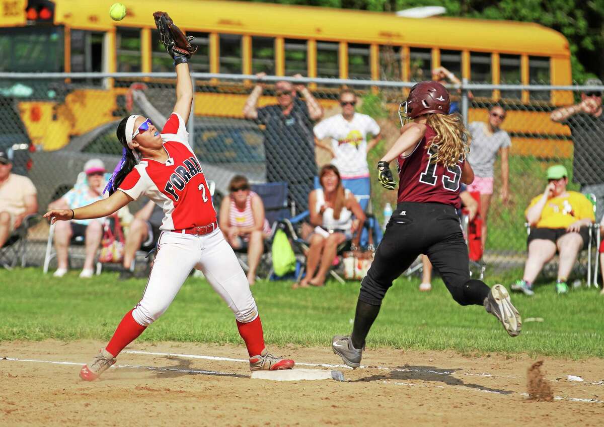 Torrington’s Brittany Anderson beats out a single in the Red Raidersí 7-3 win over Foran in the second round of the Class L state tournament.