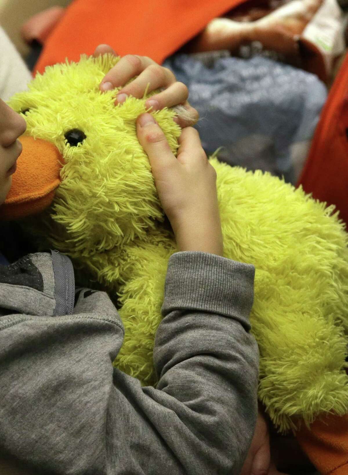 A child hugs her puppet at the end of an audience that Pope Francis held with health care workers and children with autism in the Paul VI hall at the Vatican, Saturday, Nov. 22, 2014. Pope Francis tenderly embraced children with autism spectrum disorders, during an audience Saturday aimed at offering solidarity to people living with the condition.