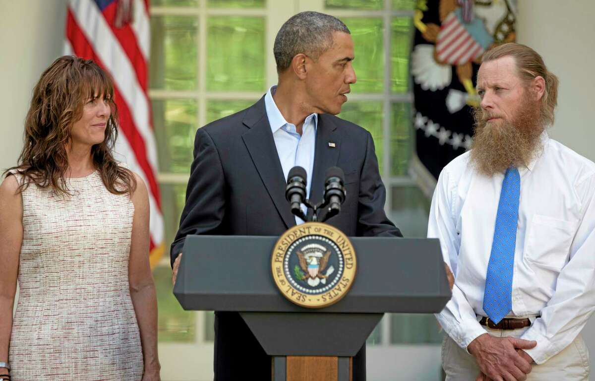 President Barack Obama looks to Bob Bergdahl as Jani Bergdahl, stands at left, during a news conference in the Rose Garden of the White House in Washington on Saturday, May 31, 2014 about the release of their son, U.S. Army Sgt. Bowe Bergdahl. Bergdahl, 28, had been held prisoner by the Taliban since June 30, 2009. He was handed over to U.S. special forces by the Taliban in exchange for the release of five Afghan detainees held by the United States. (AP Photo/Carolyn Kaster)