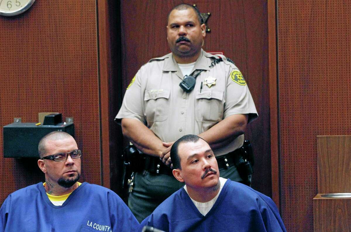 Defendants Marvin Norwood, left, and Louie Sanchez appear during a hearing Thursday Feb. 20, 2014 in Los Angeles. The two men pleaded guilty Thursday to a 2011 beating at Dodger Stadium that left San Francisco Giants fan Bryan Stow brain damaged and disabled. They were immediately sentenced by an angry judge who called them cowards and the sort of people that sports fans fear when they go to games.