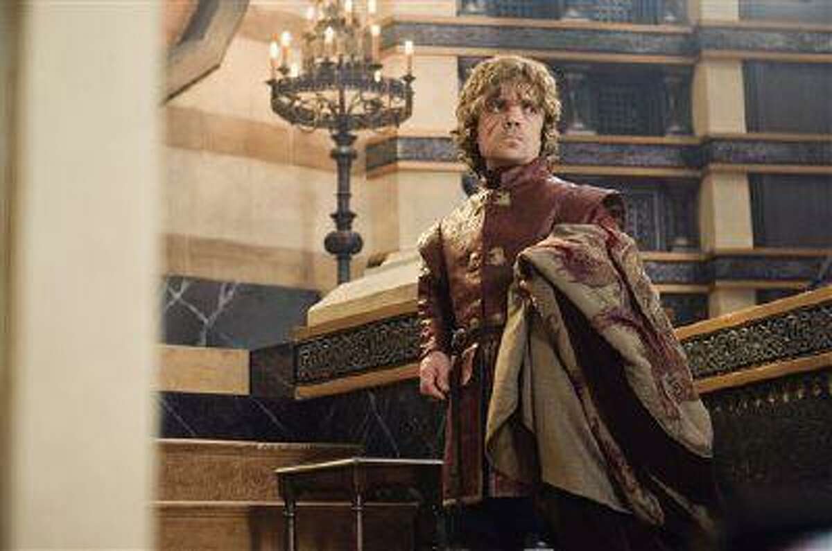 This publicity image released by HBO shows Peter Dinklage in a scene from "Game of Thrones." Dinklage was nominated for an Emmy Award for best supporting actor in a drama series on, Thursday July 18, 2013. The Academy of Television Arts & Sciences' Emmy ceremony will be hosted by Neil Patrick Harris. It will air Sept. 22 on CBS. (AP Photo/HBO, Helen Sloan)