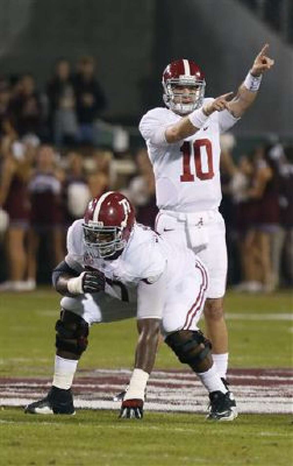 Alabama quarterback AJ McCarron (10) directs his team against Mississippi State during the first half of a game Saturday in Starkville, Miss. Alabama won 20-7.