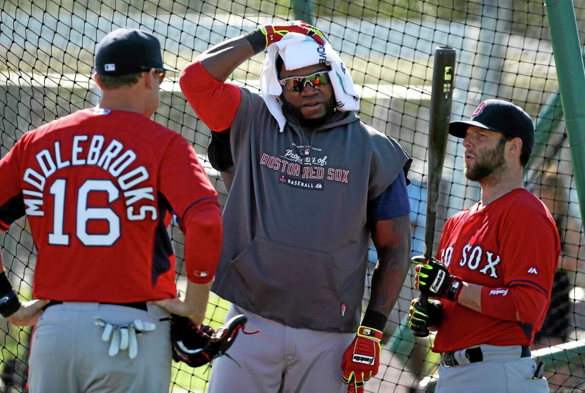 Boston Red Sox designated hitter David Ortiz, center, talks with third baseman Will Middlebrooks, left, and second baseman Dustin Pedroia during practice Tuesday in Fort Myers, Fla.