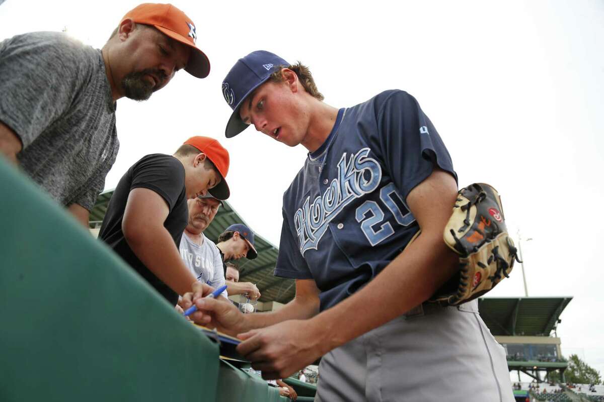 Corpus Christi Hooks pitcher Forrest Whitley a former Alamo Heights star and former first-round draft pick, takes time to sign autographs before the game against the San Antonio Missions on Aug. 25, 2017 at Wolff Stadium