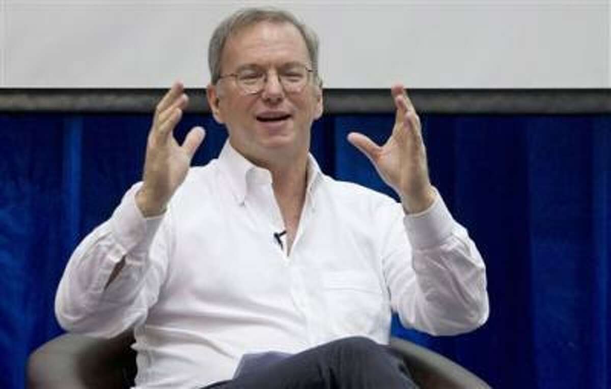 In this Friday, March 22, 2013, Google Executive Chairman Eric Schmidt gestures during an interactive session with group of students at a technical university in Yangon, Myanmar Schmidt, who spent a decade as the company s CEO, shares his ruminations and visions of a radically different future in The New Digital Age, a book that goes on sale Tuesday, April 23, 2013.