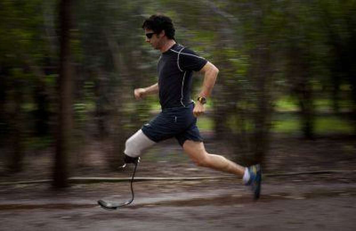 In this Aug. 28, 2010 photo, Associated Press photographer Emilio Morenatti runs during a photo session in a Mexico City public park, one year after he lost his leg during an attack while on assignment in Afghanistan. For those who lost a limb or more in the Boston Marathon, Monday, April 15, 2013, was the day their world changed forever. Morenatti's world changed also, on Tuesday, Aug. 11, 2009, when during his embed in southern Afghanistan with the U.S. military as a photographer for The Associated Press, which was to have been his last patrol before going home, the eight-wheel armored Stryker vehicle where he was traveling in with U.S soldiers hit a roadside bomb and flipped over, knocking him unconscious. Morenatti, who lost his leg below the knee in the bomb blast, says that if those maimed in Boston were to ask him what was harder, the physical or psychological recovery, he would say the two go hand-in-hand. "If you don't confront the feelings of loss, the fact that your world has changed, you never fully recover from the amputation," writes Morenatti. (AP Photo/Ramon Espinosa)
