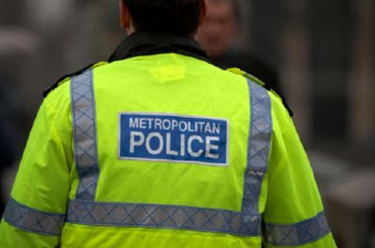 Back view of metropolitan police officer, westminster bridge, London, England, uk