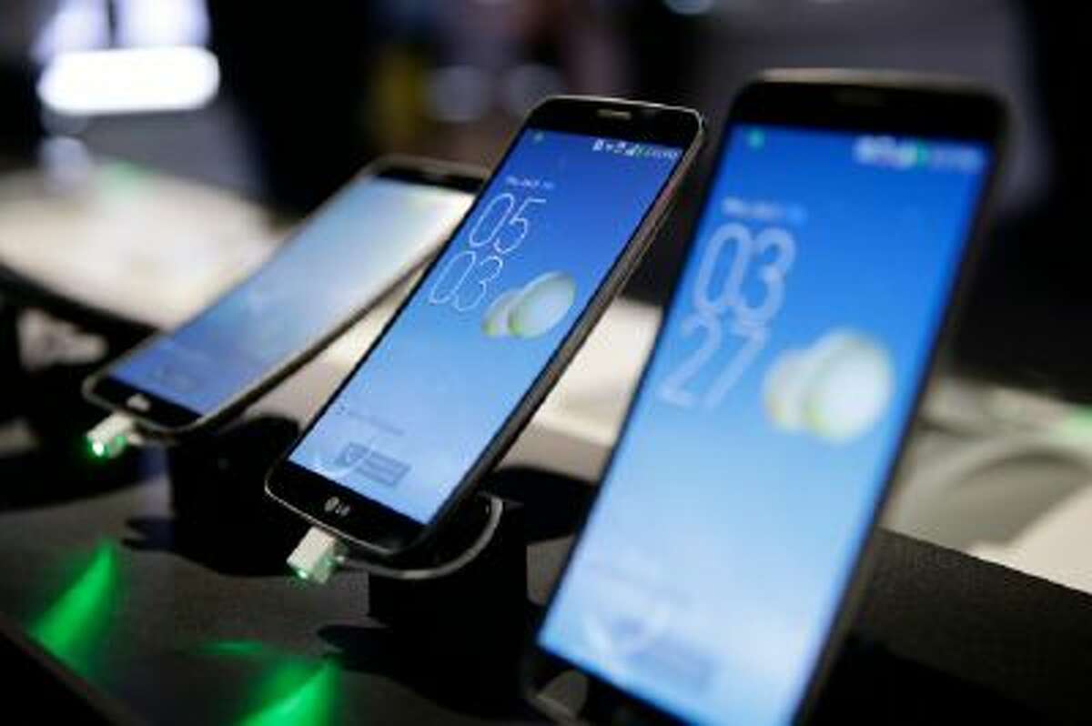 LG's G Flex smartphones are displayed at the International Consumer Electronics Show(CES) on Jan. 9, 2014, in Las Vegas.