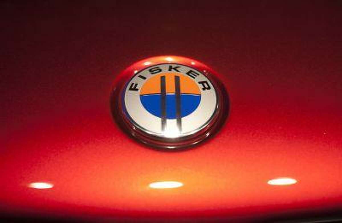 The Fisker automotive electric Atlantic sedan logo is seen during its unveiling ahead of the 2012 International Auto Show in New York. File handout photo.