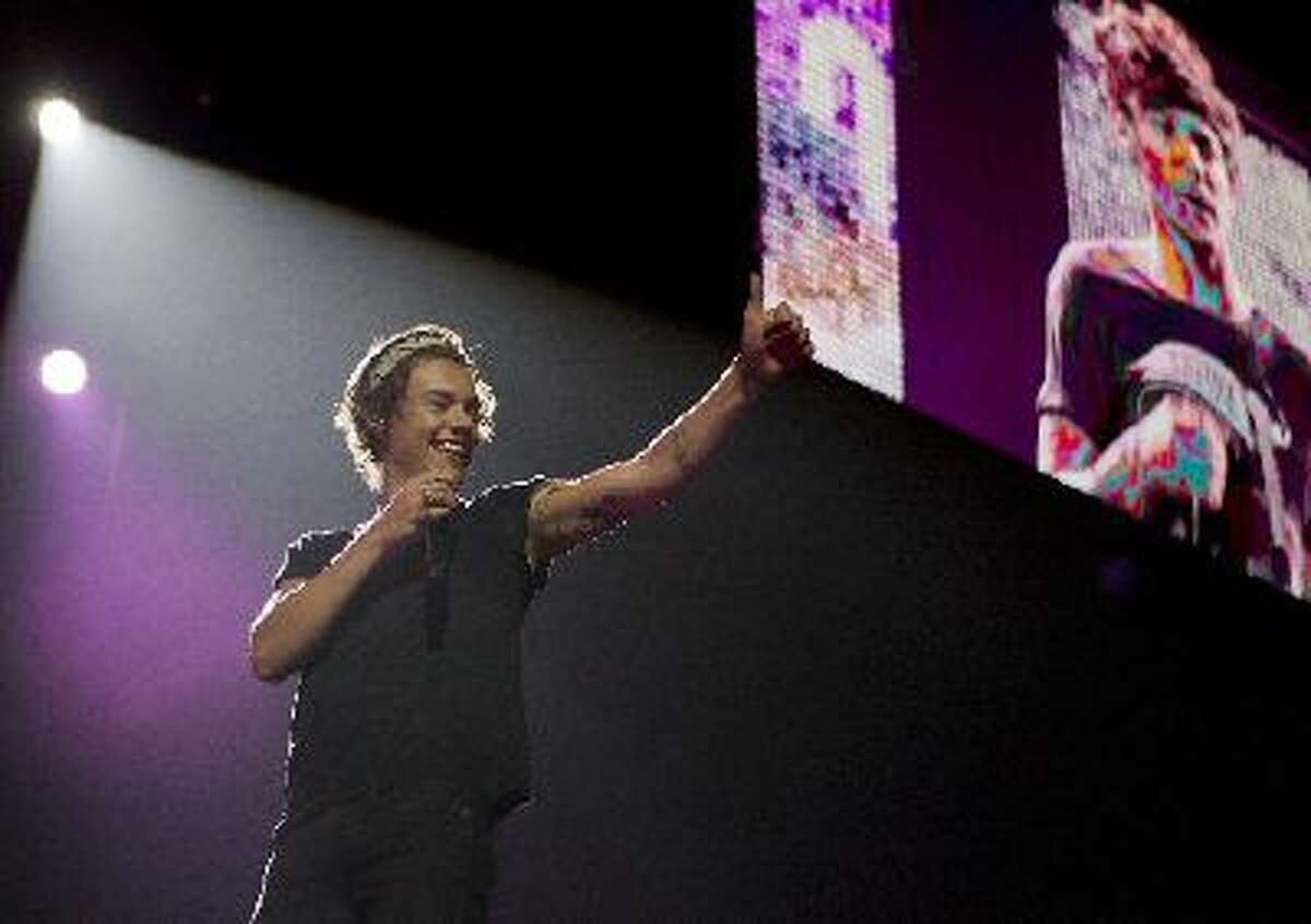 Harry Styles of the British boy band One Direction performs at SAP Center in San Jose, Calif. on Tuesday, July 30, 2013.