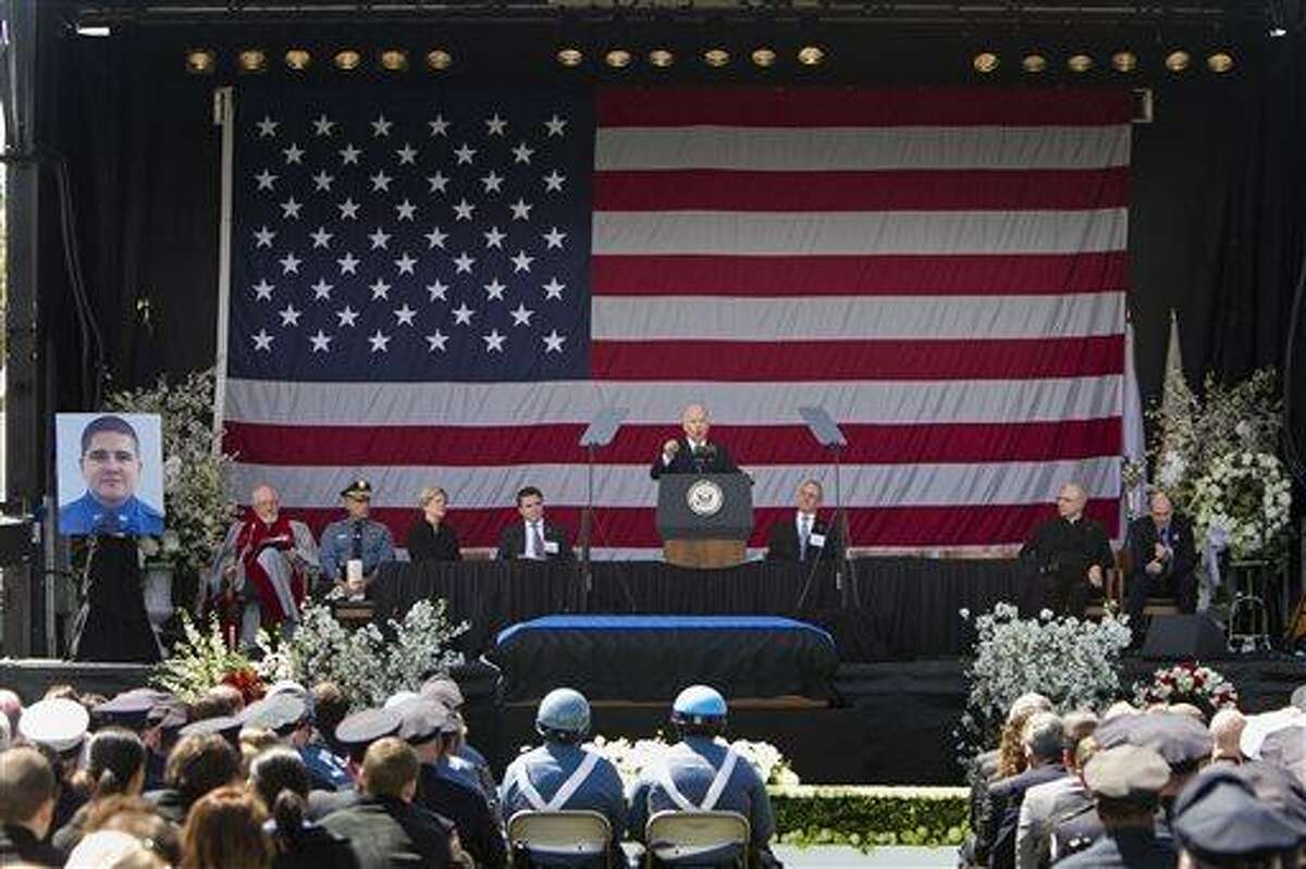 In a photo provided by Massachusetts Institute of Technology, U.S. Vice President Joe Biden speaks during a memorial service for fallen MIT police officer Sean Collier on the MIT campus in Cambridge, Mass., Wednesday, April 24, 2013. Collier was fatally shot on campus Thursday, April 18, 2013. Authorities allege that the Boston Marathon bombing suspects were responsible. (AP Photo/Massachusetts Institute of Technology, Dominick Reuter)