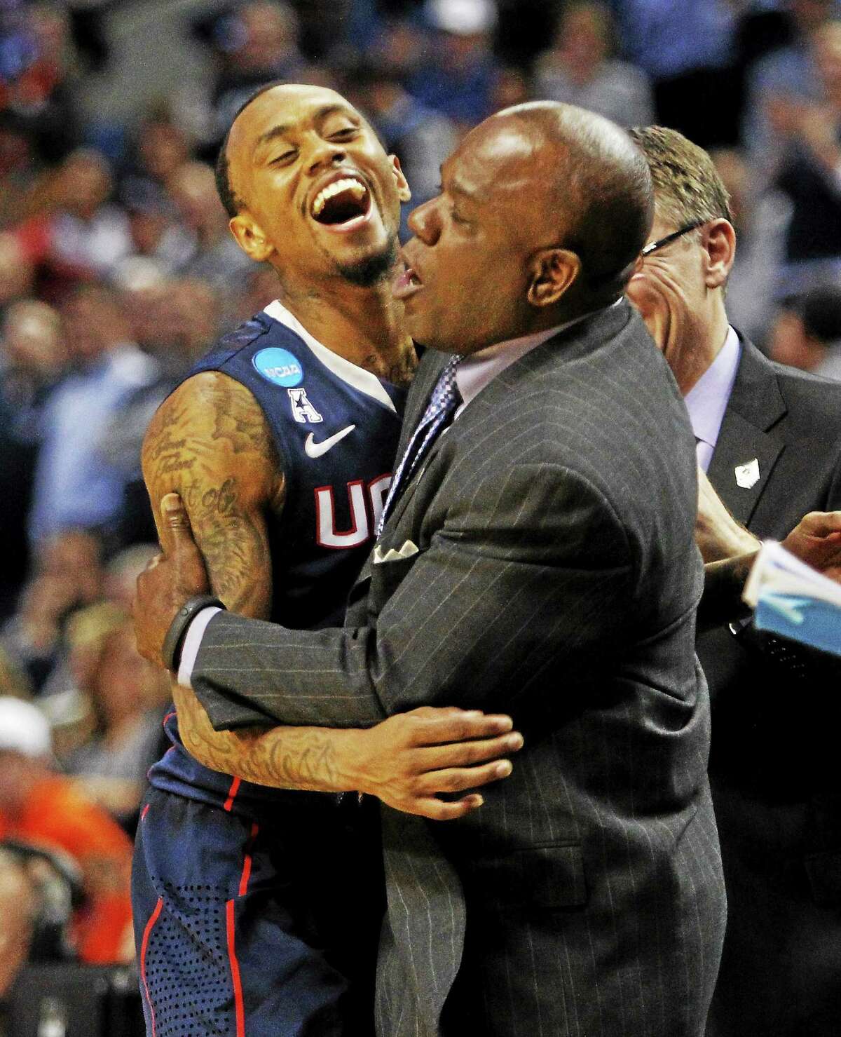 UConn guard Ryan Boatright celebrates with assistant coach Karl Hobbs late in the second half of the Huskies’ 77-65 win over Villanova in the third round of the NCAA tournament on March 22 in Buffalo, N.Y.