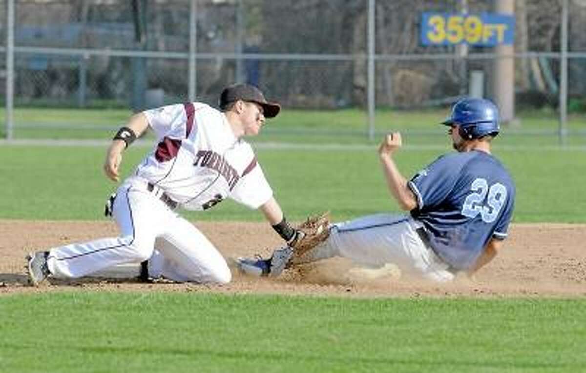 Photo by Laurie Gaboardi/Register Citizen Torrington's John McCarthy tags out an Ansonia baserunner.